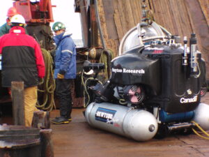 Using the crane to launch a diving exploration pod.